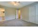 Cozy bedroom with neutral colors, carpet floors, and double door closet providing storage at 1283 Maple St, Conyers, GA 30013
