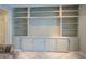 Neutral built-in shelves with storage cabinets, offering ample space for organizing and displaying décor at 1283 Maple St, Conyers, GA 30013