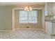 Dining area with a chandelier and window with backyard view at 1283 Maple St, Conyers, GA 30013