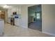 Open concept kitchen with stainless steel appliances and granite countertops view to living room at 1283 Maple St, Conyers, GA 30013