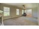 Bright living room featuring large windows and a cozy seating area at 1283 Maple St, Conyers, GA 30013