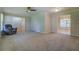 Living room with neutral carpeting and recessed lighting, featuring a ceiling fan at 1283 Maple St, Conyers, GA 30013