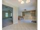 Open living room featuring tile floors, neutral walls, and built-in shelving; great space for gatherings at 1283 Maple St, Conyers, GA 30013