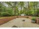 Backyard storage shed with double doors and green accents, set in a well-maintained yard at 1283 Maple St, Conyers, GA 30013
