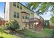 Exterior of house from the backyard shows the deck, patio, stairs, and ample yard space at 1610 Apollo Dr, Suwanee, GA 30024