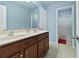 Bathroom with double vanity, large mirror, and view into the shower at 1610 Apollo Dr, Suwanee, GA 30024