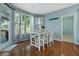 Bright breakfast nook with hardwood floors, a table with chairs, and a large window with wooded views at 1610 Apollo Dr, Suwanee, GA 30024