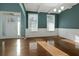 Bright living room with hardwood floors, coffered ceiling, and large windows with white trim at 1610 Apollo Dr, Suwanee, GA 30024