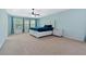 Spacious main bedroom features carpet flooring, a ceiling fan and natural light at 1610 Apollo Dr, Suwanee, GA 30024