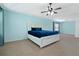 Bright main bedroom offers lots of natural light, a ceiling fan and a modern aesthetic at 1610 Apollo Dr, Suwanee, GA 30024