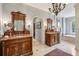 Luxurious bathroom featuring dual vanities, marble counters, and walk-in closet at 4195 Woodland Brook Se Dr, Atlanta, GA 30339