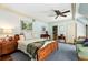 Cozy bedroom with a comfortable bed, ceiling fan, and natural light at 4195 Woodland Brook Se Dr, Atlanta, GA 30339
