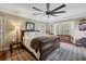 Inviting bedroom featuring a large bed, desk, and serene atmosphere at 4195 Woodland Brook Se Dr, Atlanta, GA 30339