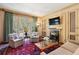 Inviting sitting room with a fireplace, built-ins, and access to an outdoor terrace, perfect for relaxation at 4195 Woodland Brook Se Dr, Atlanta, GA 30339