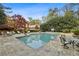 Beautiful swimming pool surrounded by lush landscaping and lounge chairs at 4195 Woodland Brook Se Dr, Atlanta, GA 30339