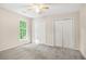 Bedroom with neutral paint, carpeting, ceiling fan and closets at 6493 Crooked Creek Pl, Lithonia, GA 30058