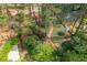 Overhead view of backyard showing a path, mature trees, and lush landscaping at 6795 Brandon Mill Rd, Atlanta, GA 30328