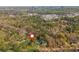 A high definition aerial view of residential neighborhood with mature trees in the distance at 6795 Brandon Mill Rd, Atlanta, GA 30328