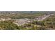 An aerial view of a mixed use business district with residential homes and mature trees in the area at 6795 Brandon Mill Rd, Atlanta, GA 30328