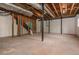 Spacious unfinished basement showcasing exposed ceiling and concrete floor at 6795 Brandon Mill Rd, Atlanta, GA 30328
