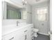 Bright bathroom with light gray walls, tile flooring, and large vanity mirror at 6795 Brandon Mill Rd, Atlanta, GA 30328