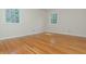 Large bedroom with hardwood floors, light walls, and ample natural light at 6795 Brandon Mill Rd, Atlanta, GA 30328
