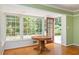 Charming dining area with ample natural light and views of the backyard through large windows at 6795 Brandon Mill Rd, Atlanta, GA 30328