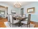 Elegant dining room featuring a modern chandelier, table and chairs set for dining at 6795 Brandon Mill Rd, Atlanta, GA 30328