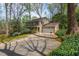 A charming two-story home with a two-car garage and a manicured lawn with lush landscaping at 6795 Brandon Mill Rd, Atlanta, GA 30328