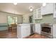 Bright kitchen with white cabinets, stainless steel appliances, and an adjacent dining area at 6795 Brandon Mill Rd, Atlanta, GA 30328