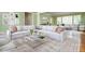 Bright living room with large, comfortable sectional sofa, glass coffee table and stylish area rug at 6795 Brandon Mill Rd, Atlanta, GA 30328