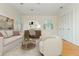 Spacious living room features a work space, neutral walls, hardwood flooring, and ample natural light at 6795 Brandon Mill Rd, Atlanta, GA 30328