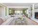 Open-concept living room featuring a fireplace, built-in shelving, and comfortable seating at 6795 Brandon Mill Rd, Atlanta, GA 30328