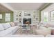 Inviting living room with fireplace, built-in bookshelves, comfortable seating, and neutral décor at 6795 Brandon Mill Rd, Atlanta, GA 30328