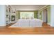 Spacious living room with fireplace, built-in shelving, and large windows providing natural light at 6795 Brandon Mill Rd, Atlanta, GA 30328