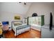 Bedroom featuring a vaulted ceiling, a large window, and wood flooring at 9176 Lakeview Parkway, Villa Rica, GA 30180