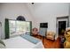 Bright bedroom with a vaulted ceiling, a large window and wood flooring at 9176 Lakeview Parkway, Villa Rica, GA 30180