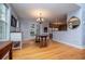 Dining room area boasting hardwood floors and views through the French doors to the exterior at 9176 Lakeview Parkway, Villa Rica, GA 30180