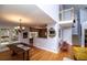 Dining area with hardwood floors, chandelier, and access to the outdoor deck at 9176 Lakeview Parkway, Villa Rica, GA 30180