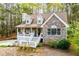 Charming home with stone and siding exterior, inviting front porch, and mature trees at 9176 Lakeview Parkway, Villa Rica, GA 30180