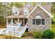 Charming home with stone and siding exterior, inviting front porch, and manicured landscaping at 9176 Lakeview Parkway, Villa Rica, GA 30180