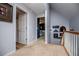 Upstairs hallway with neutral carpet, fresh paint, and doorways leading to other rooms, offering seamless flow at 9176 Lakeview Parkway, Villa Rica, GA 30180