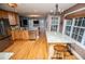 Bright and open kitchen with stainless appliances, granite countertops, and an island with bar seating at 9176 Lakeview Parkway, Villa Rica, GA 30180