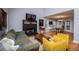 Open concept living room and dining room featuring a stone fireplace and hardwood floors at 9176 Lakeview Parkway, Villa Rica, GA 30180