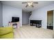 Comfortable living room with ceiling fan, vintage furnishings, and access to the bathroom at 9176 Lakeview Parkway, Villa Rica, GA 30180