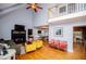 Bright living room with vaulted ceilings, stone fireplace, hardwood floors and open layout at 9176 Lakeview Parkway, Villa Rica, GA 30180