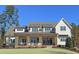 Charming two-story home with a covered porch, decorative wreaths, and manicured landscaping at 00 Daxton Dr (Lot 74), Canton, GA 30115