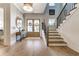 Bright foyer with hardwood floors, staircase, and decorative accents at 00 Daxton Dr (Lot 74), Canton, GA 30115