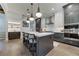 Spacious kitchen featuring a large island, modern appliances, and designer lighting fixtures at 00 Daxton Dr (Lot 74), Canton, GA 30115