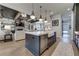 Open concept kitchen with an island, stainless steel appliances, and view to living room at 00 Daxton Dr (Lot 74), Canton, GA 30115